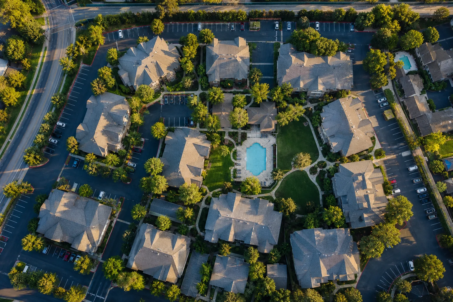 8 accounting red flags in multi-family real estate due diligence illustrated by aerial view of a multi-family apartment complex