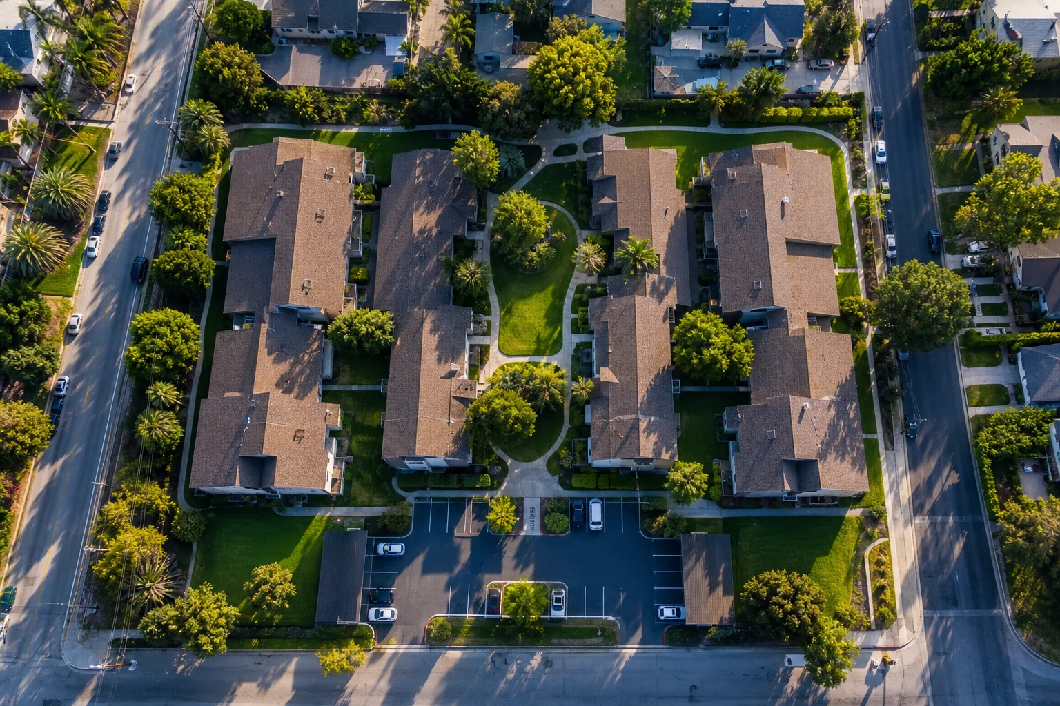 Aerial view of multi-unit apartment complex representing property management bookkeeping for large rental portfolios