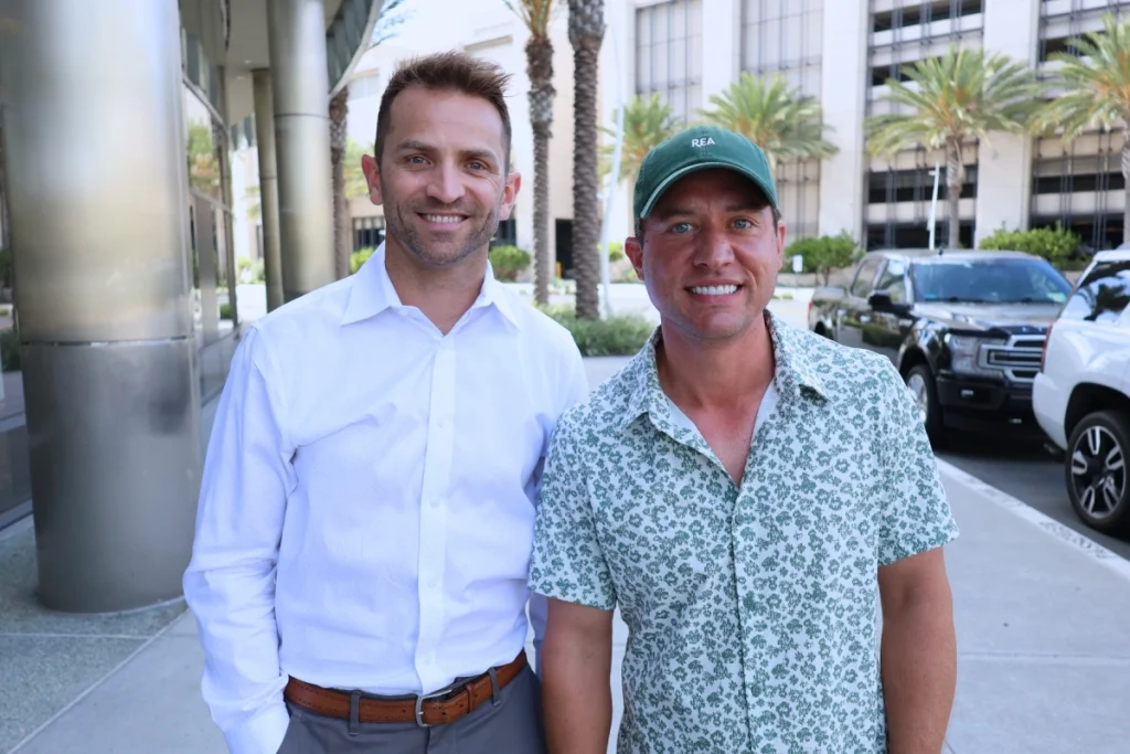 REA co-founders Mark Kappelman and Adam Eatros outside the office